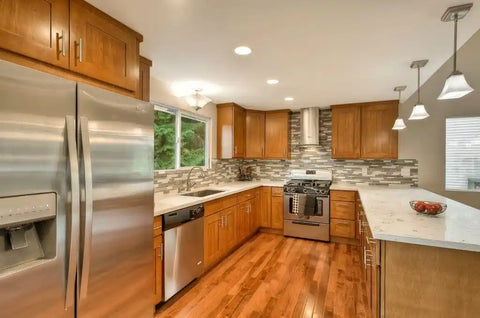 Quartz countertops paired with modern brown kitchen cabinets and island seating